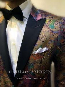 A close up of the jacket and tie on a man.