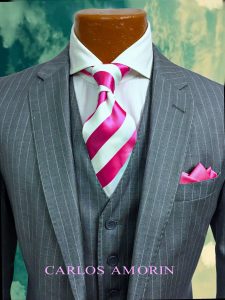 A suit and tie with pink stripes on it